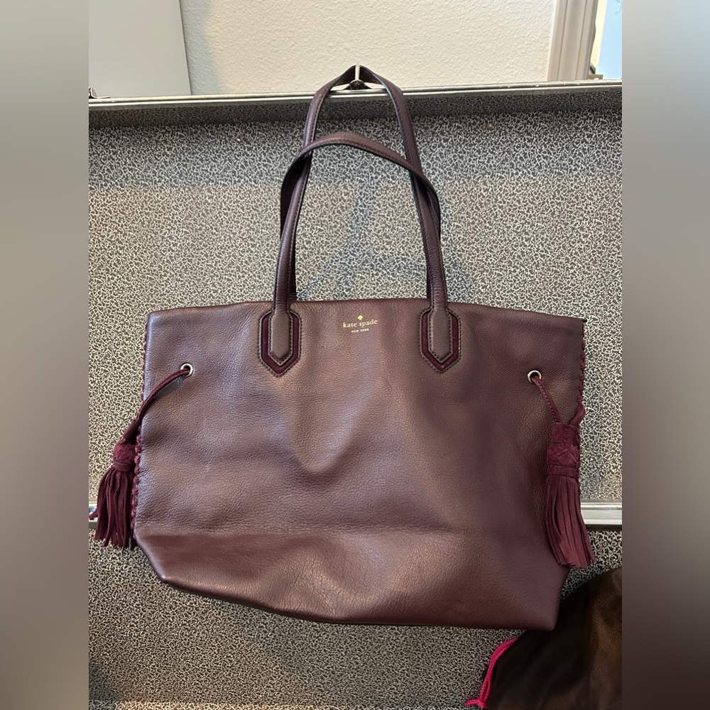 kate spade pebbled leather tote with suede tassels